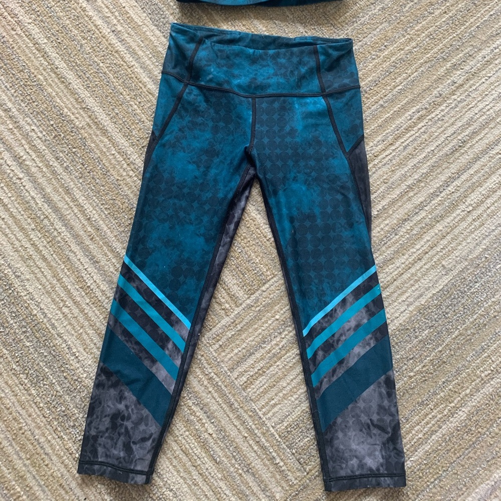 With workout set (sports bra and leggings)
